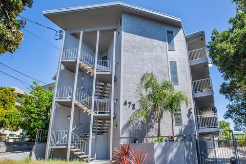 Apartment building with the number 472 on the side.