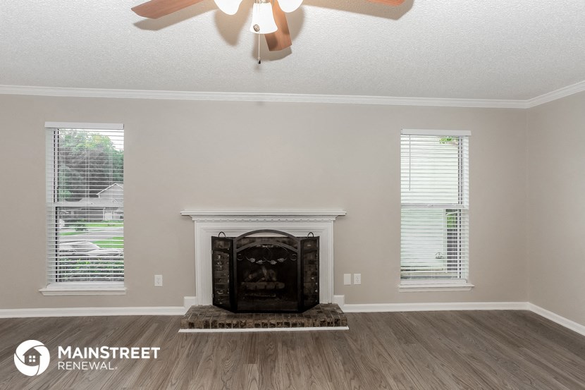the living room of a house with a fireplace
