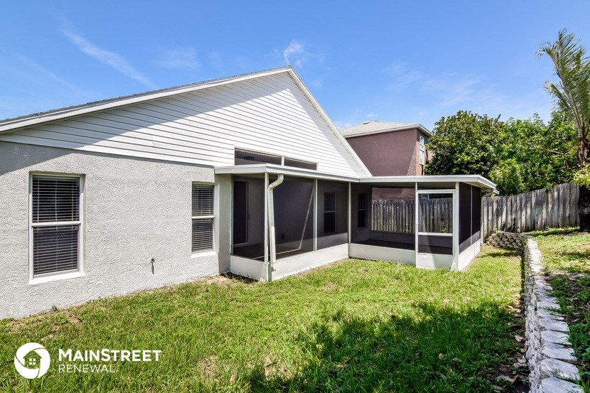 a small screened porch in front of a house