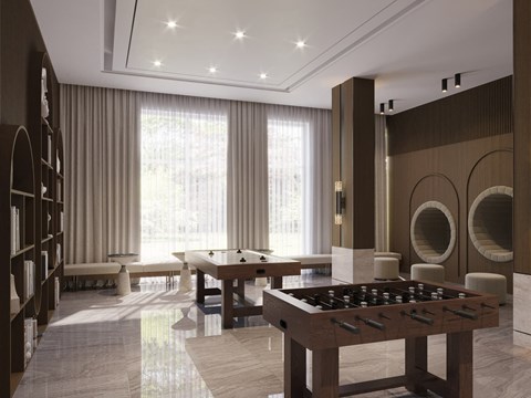 A room with a pool table and a foosball table.