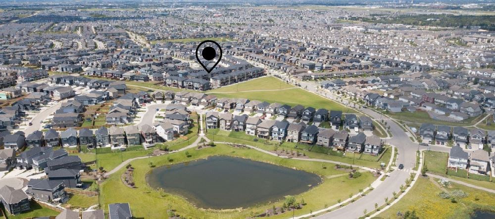 a aerial view of a suburb of a city with a kite flying over it