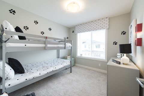 a kids bedroom with bunk beds and a window