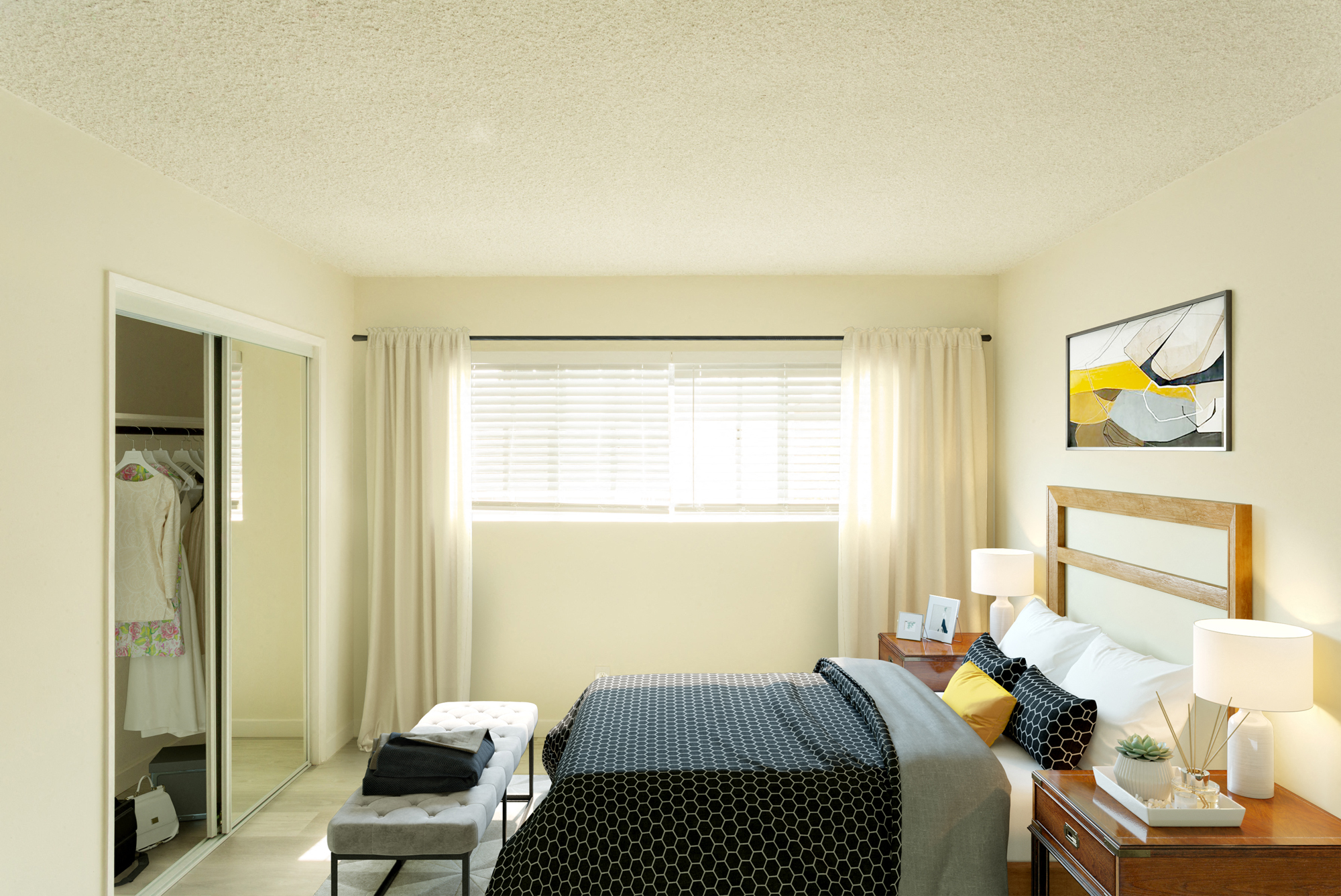 Bright white bedroom with large window and sliding mirror over closet