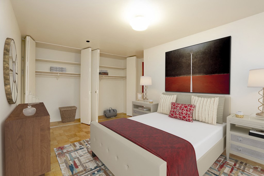 a bedroom with a bed and a painting on the wall