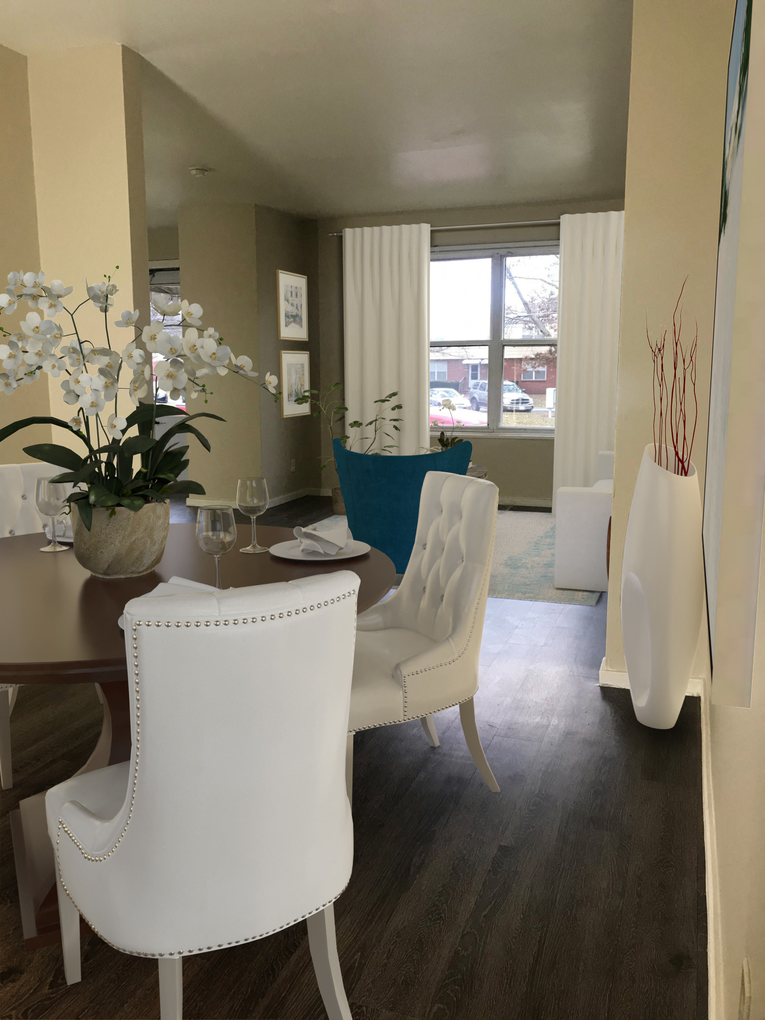 a dining room with white chairs and a table