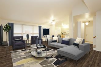 a living room with couches and chairs and a table