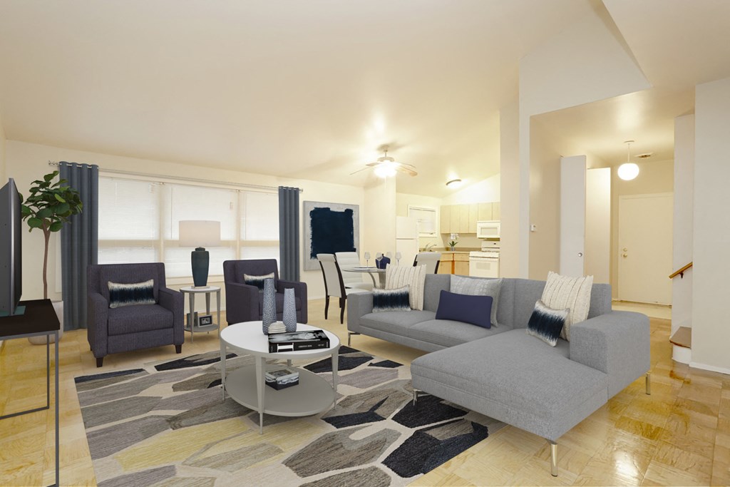 a living room with couches and chairs and a table