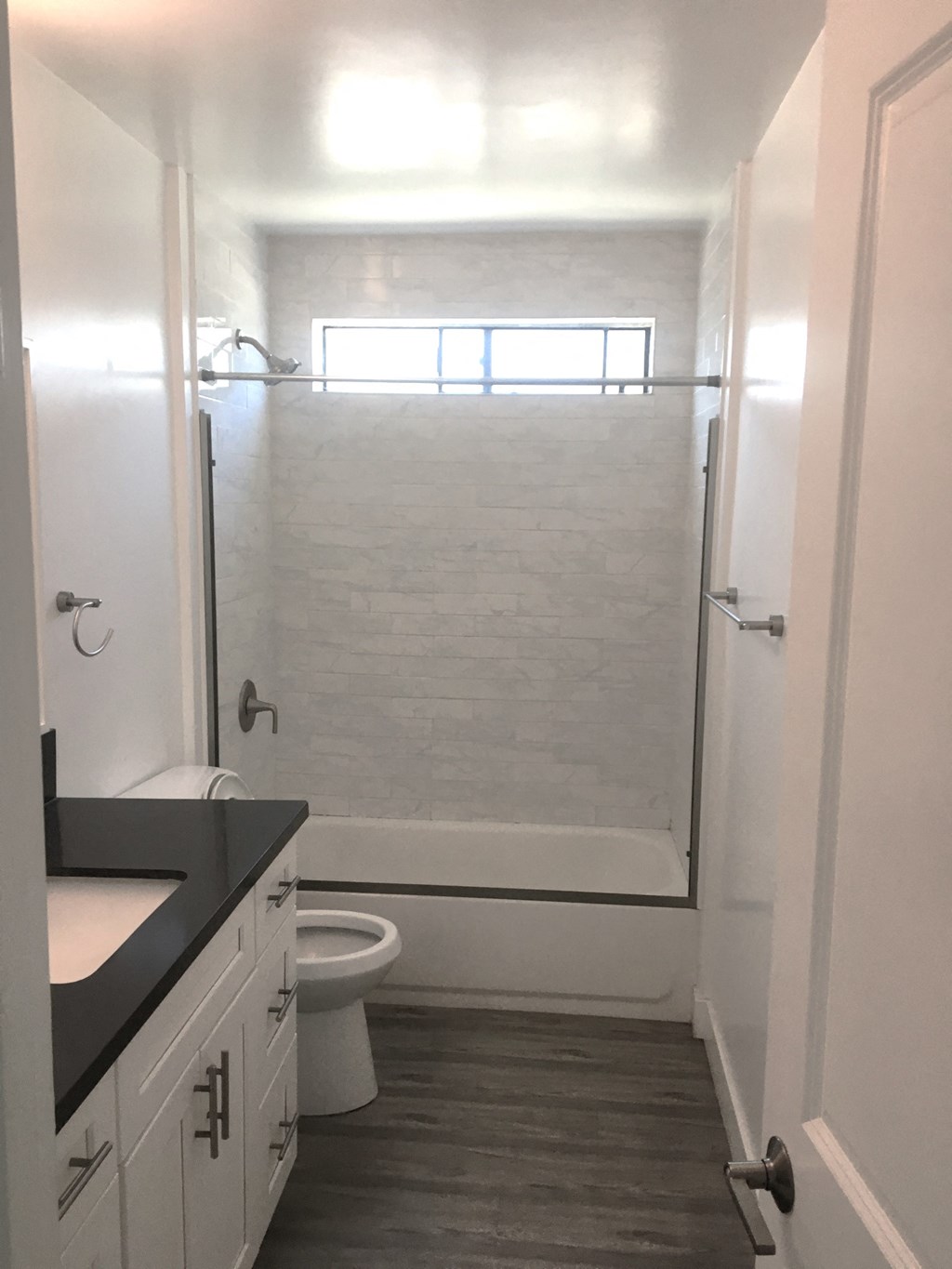 a small bathroom with a shower and a toilet