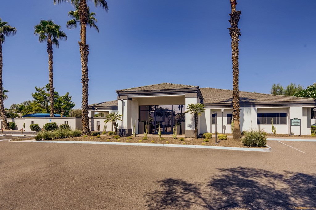 a building with palm trees in front of it