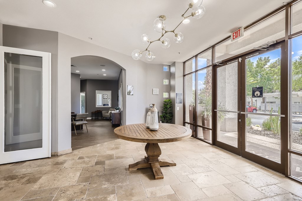 the lobby of a building with a table in the middle of it