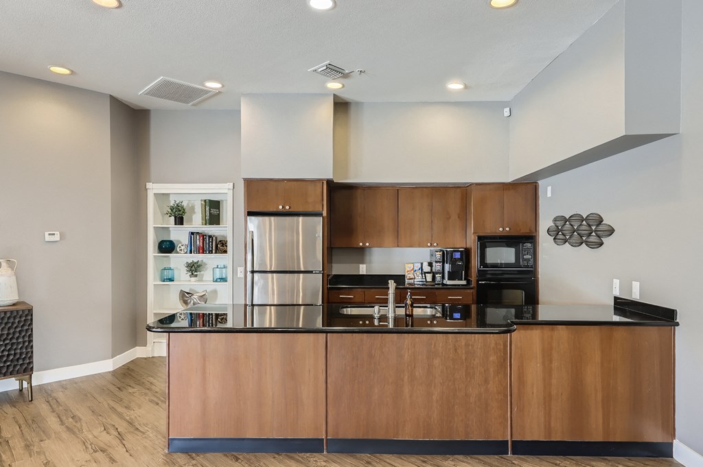 a kitchen with a counter top and a refrigerator