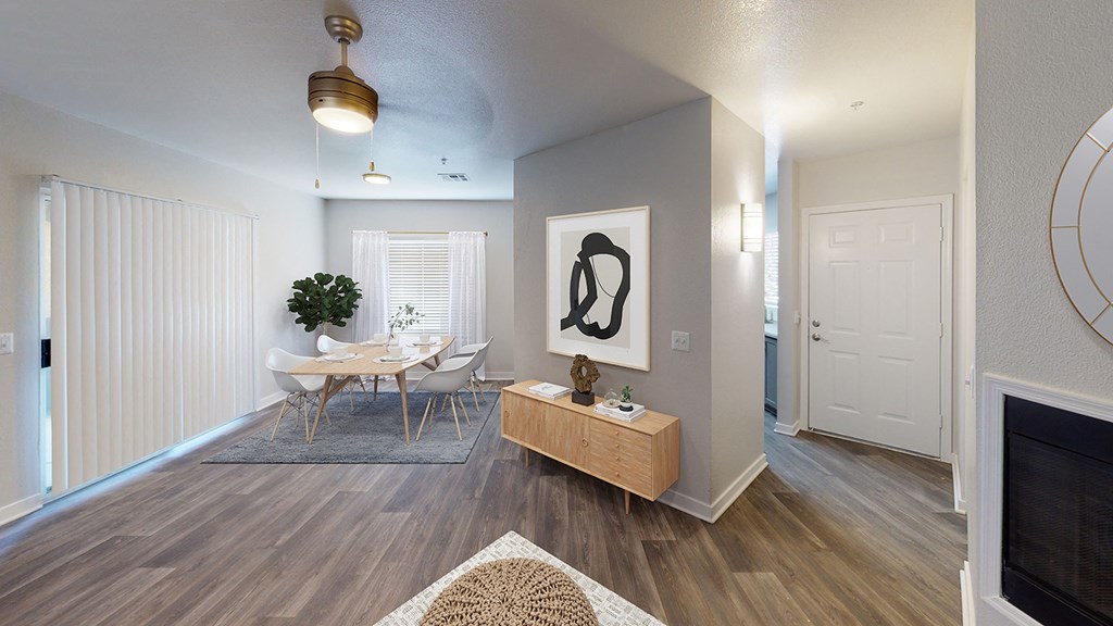 an open living room and dining room with a table and chairs