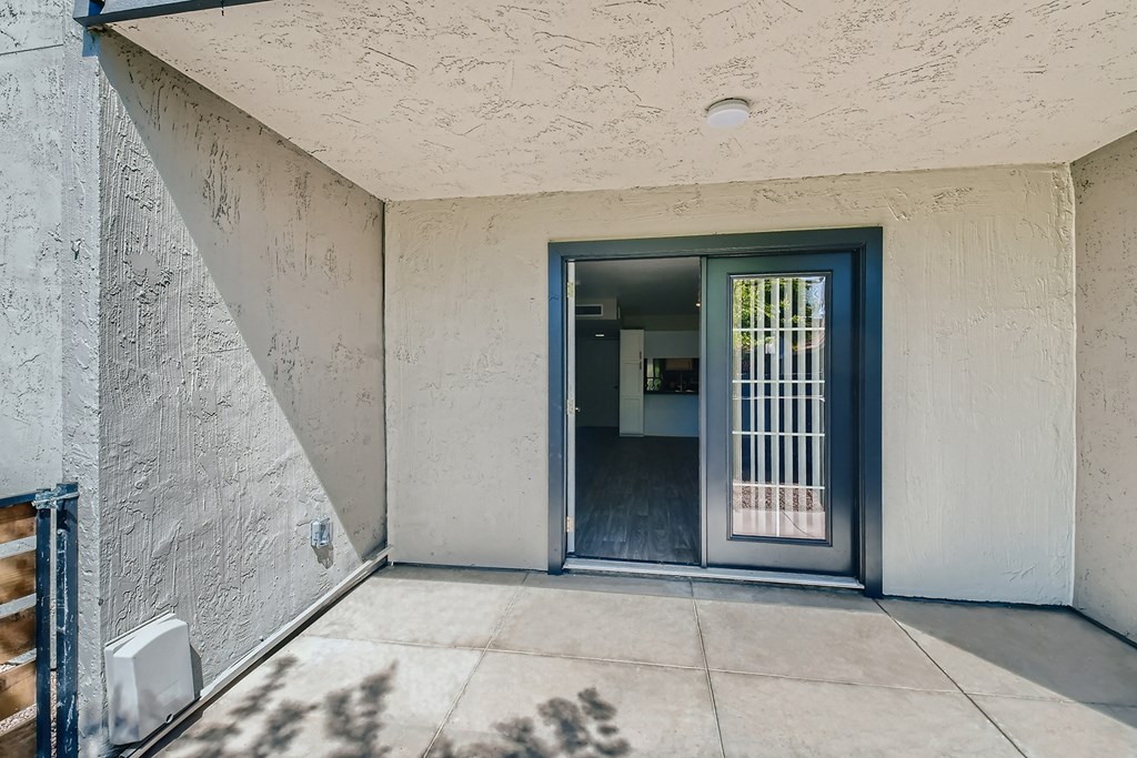 the entrance to a house with a blue door