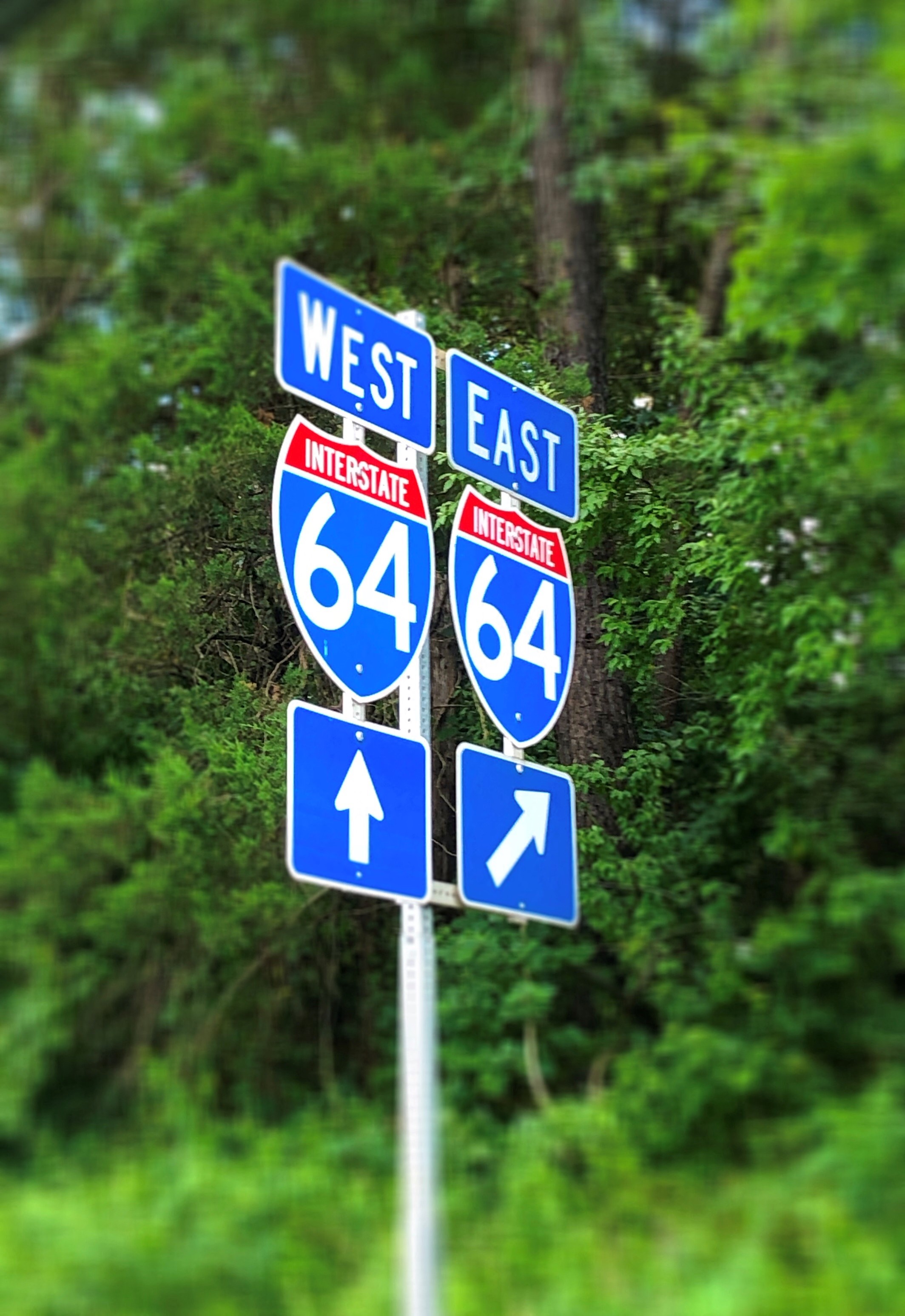 an interstate highway sign with directions to west east and interstate 664
