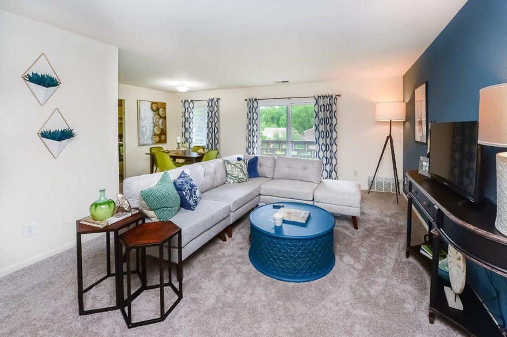 a living room with a couch and a table