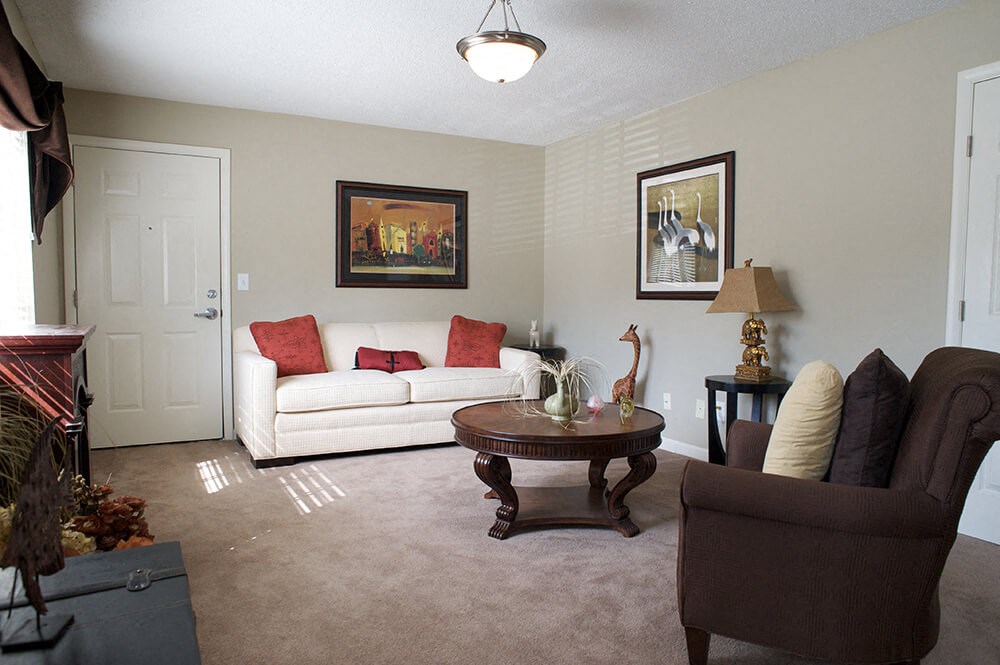 a living room with a couch and a table