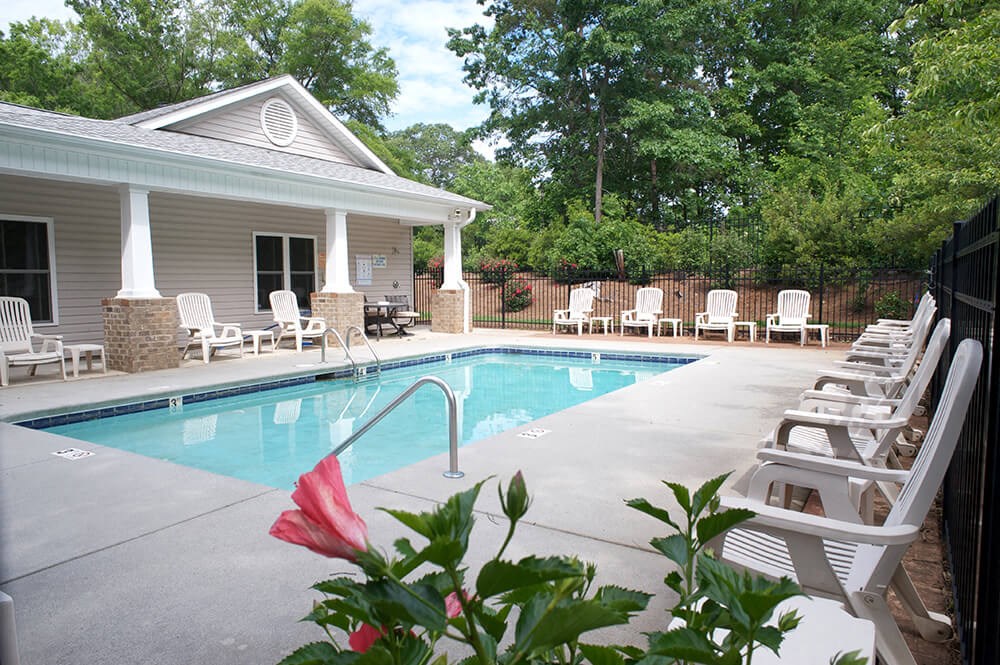 a swimming pool in front of a house