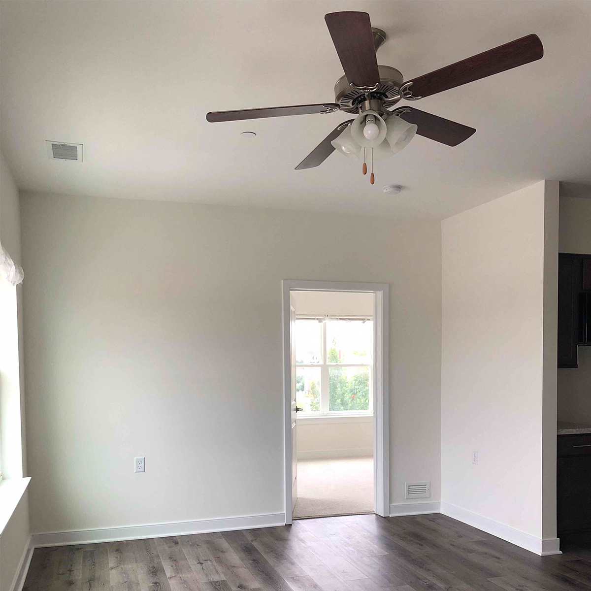 Interior living room with view of bedroom interior
