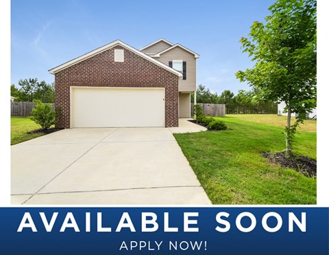 a house with a driveway and a garage door