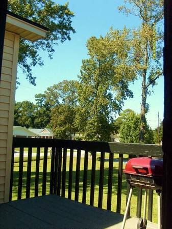 a view of a backyard with a grill