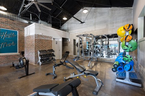 the gym at the district flats apartments in lenexa