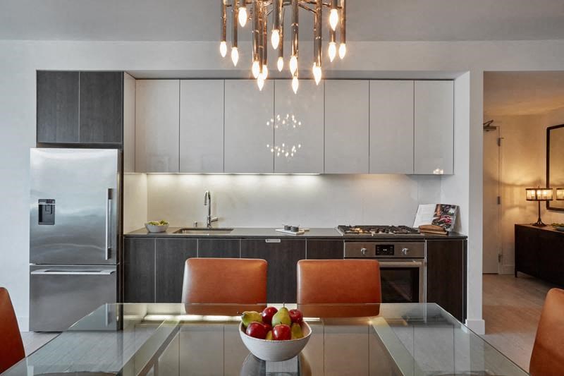 a kitchen with a bowl of fruit on a table