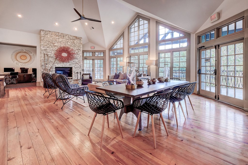 a large dining room with a table and chairs and a fireplace