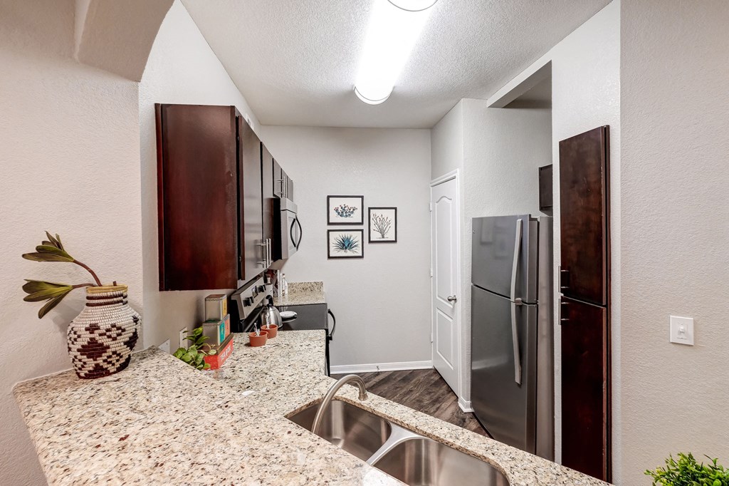our spacious kitchen has granite counter tops and stainless steel appliances
