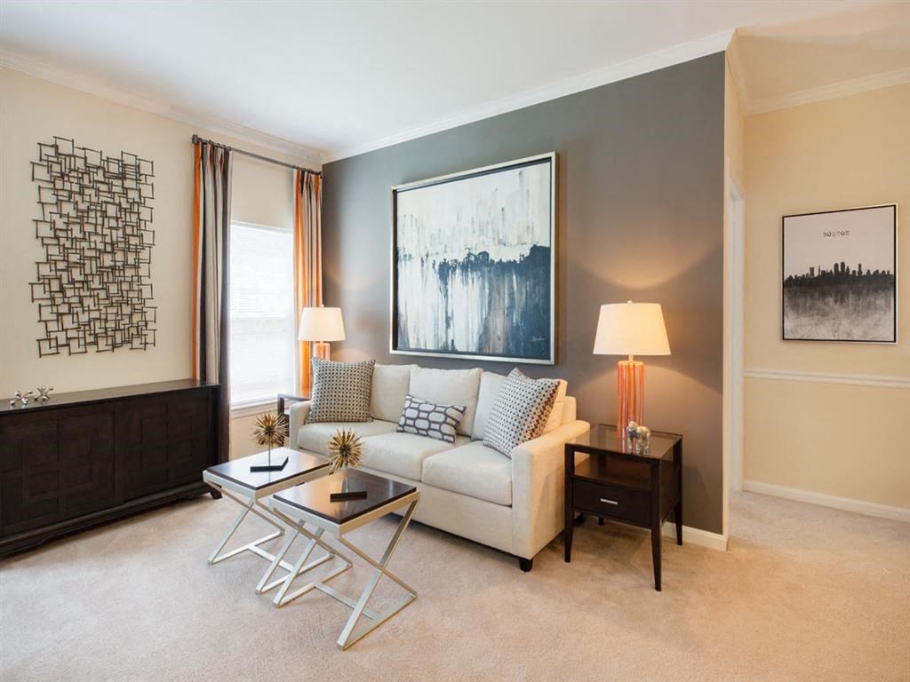 a living room with a couch and a table