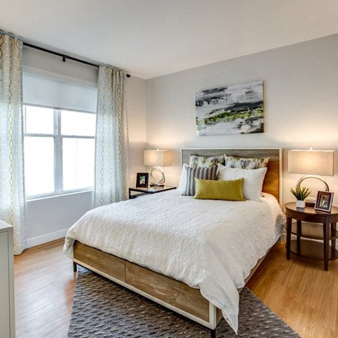 a bedroom with a bed and a window