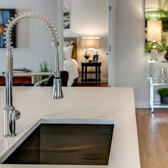 a kitchen with a sink and a faucet