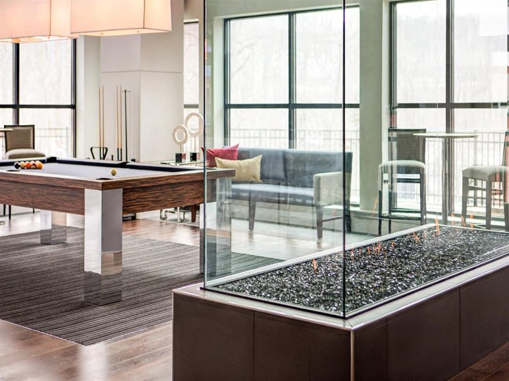 a billiards table in a living room with a pool table