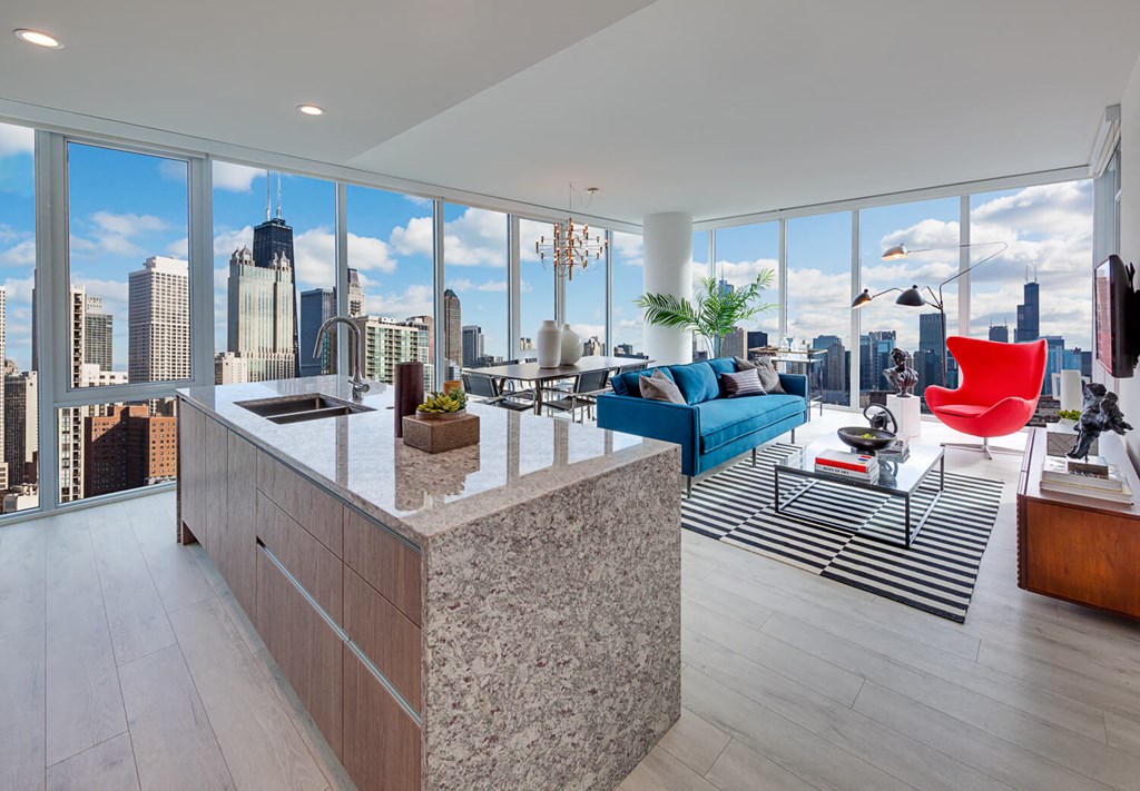a kitchen and living room with a view of the city