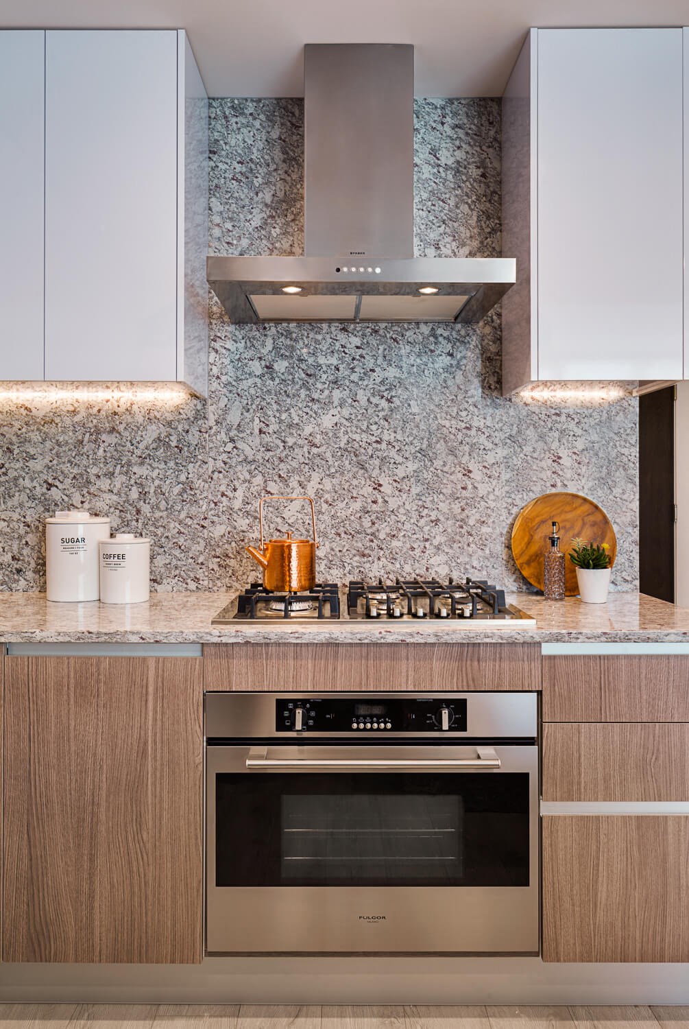 a kitchen with a stove and a microwave