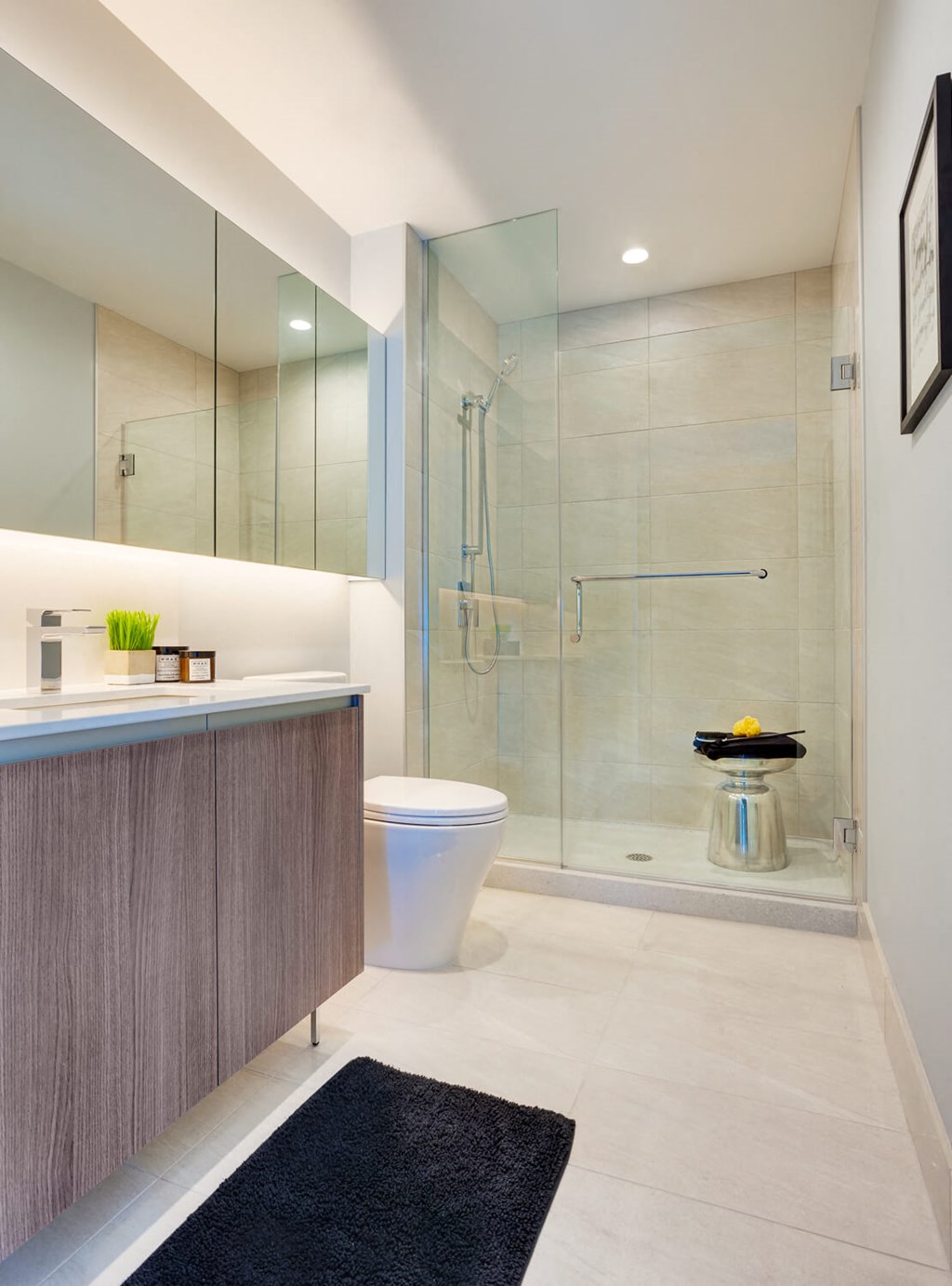 a bathroom with a toilet and a glass shower