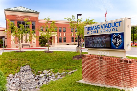 a sign in front of a middle school