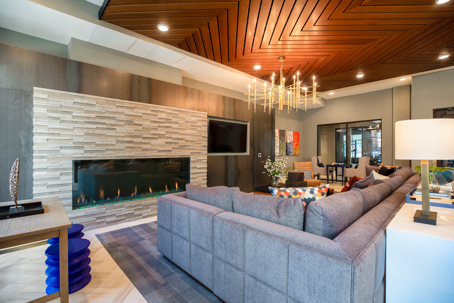 a living room with a couch and a fireplace