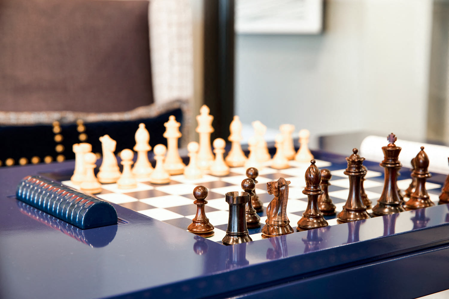 a chess board with chess pieces on a table