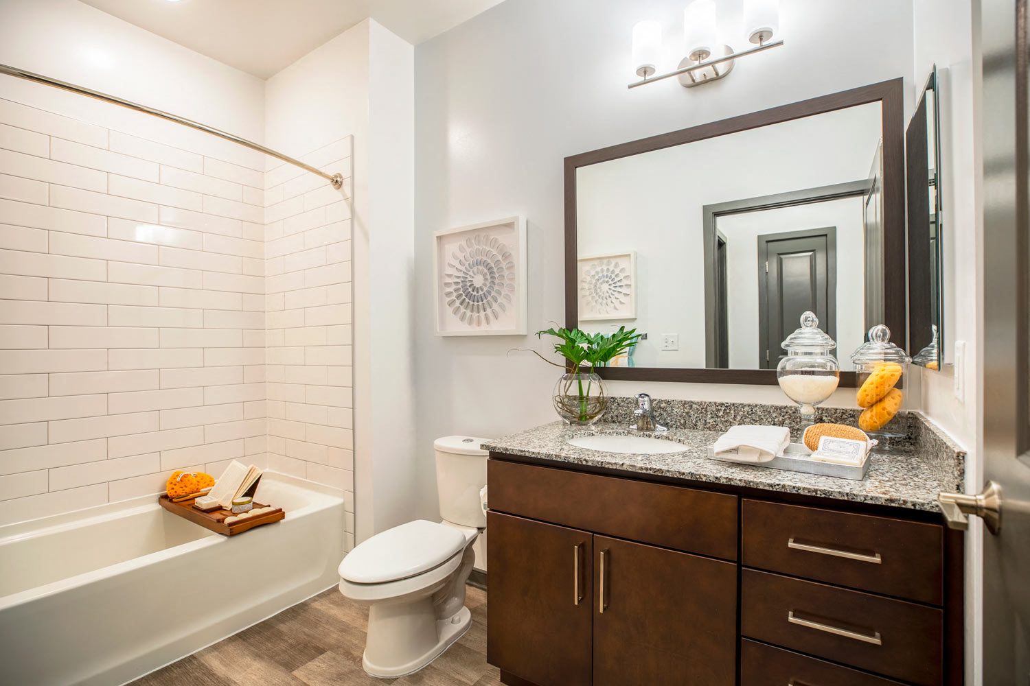 a bathroom with a sink and a toilet and a shower