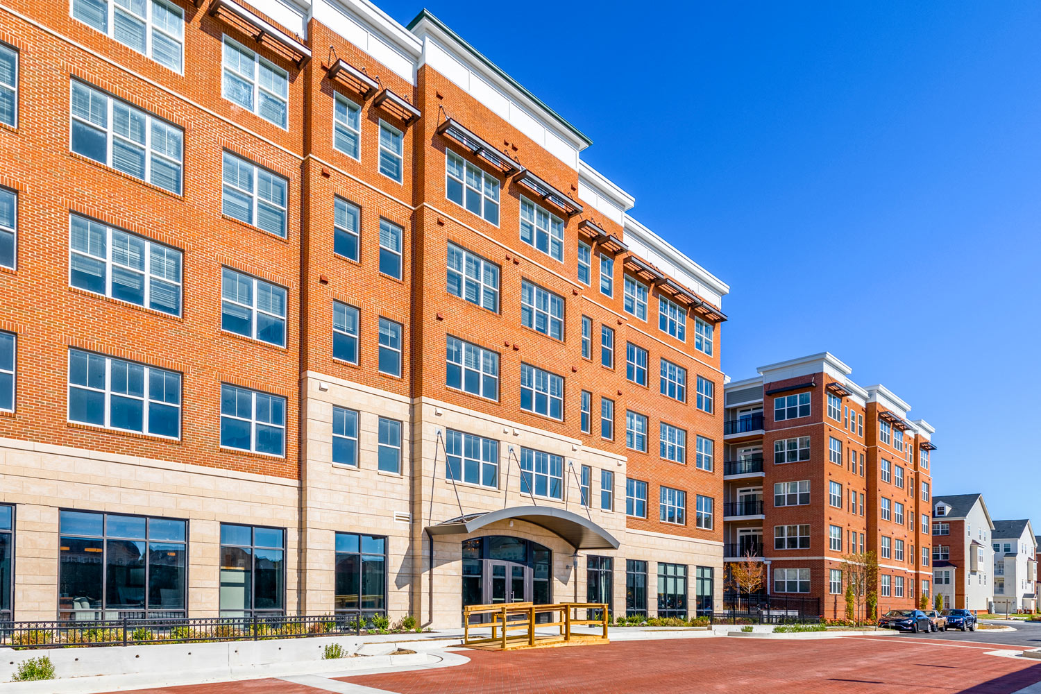 a large brick building with a street in front of it