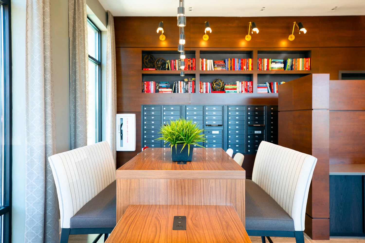 a dining room with a table and chairs and a book shelf