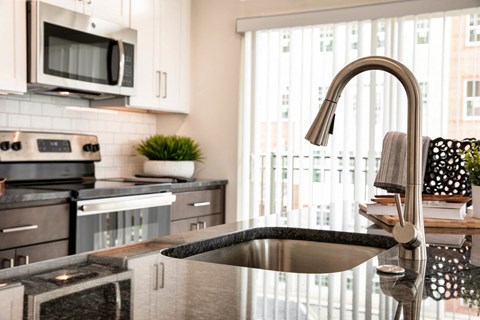 a kitchen with a sink and a window
