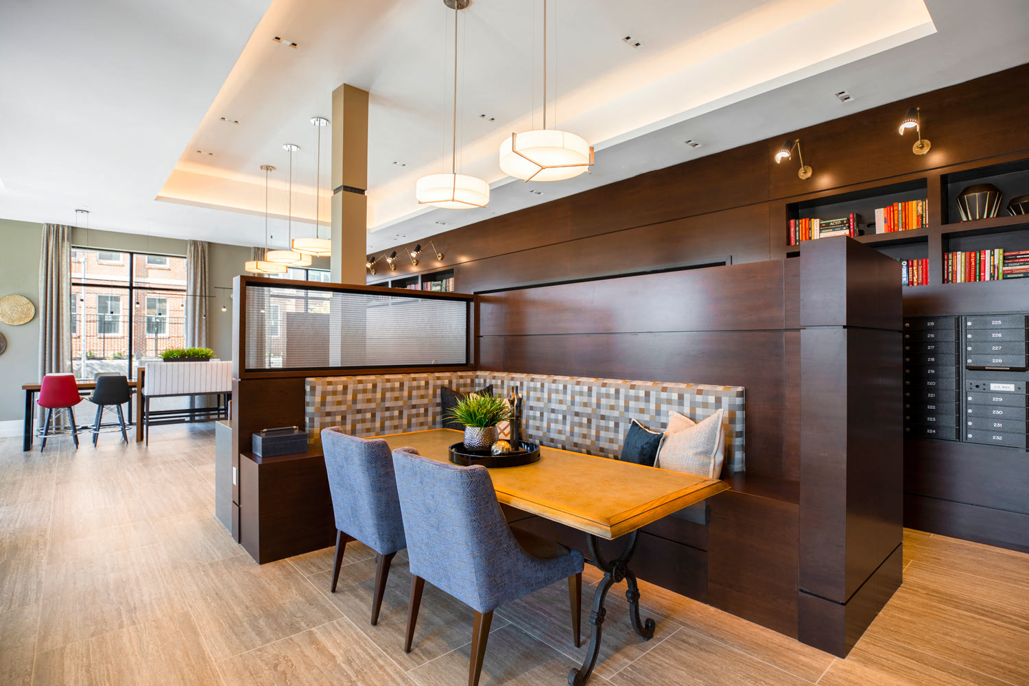 a dining room with a table and chairs and a library