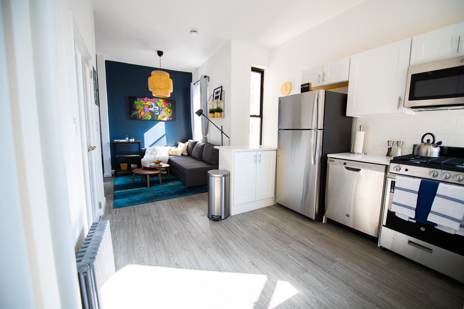 a small apartment with a kitchen and living room