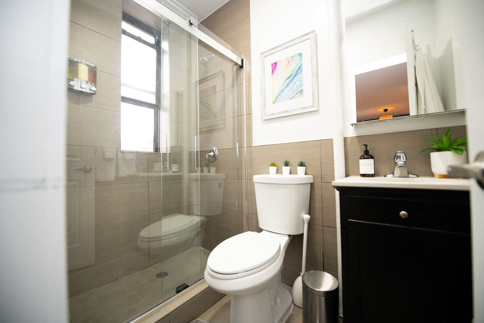 a small bathroom with a toilet and a shower