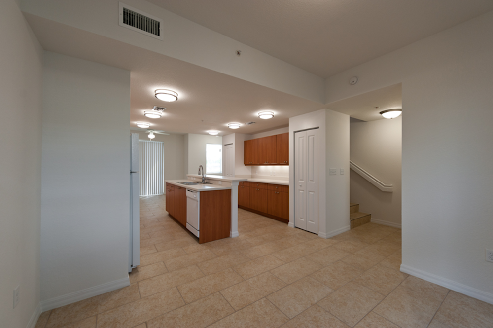 living room looking into spacious kitchen