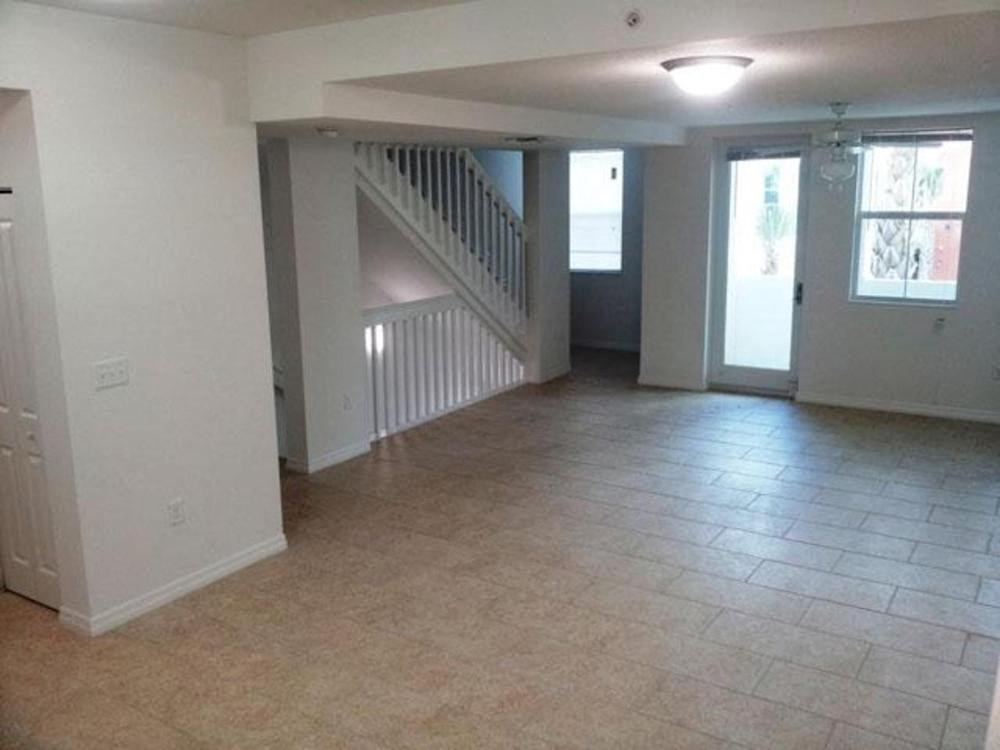 large living room with tile flooring