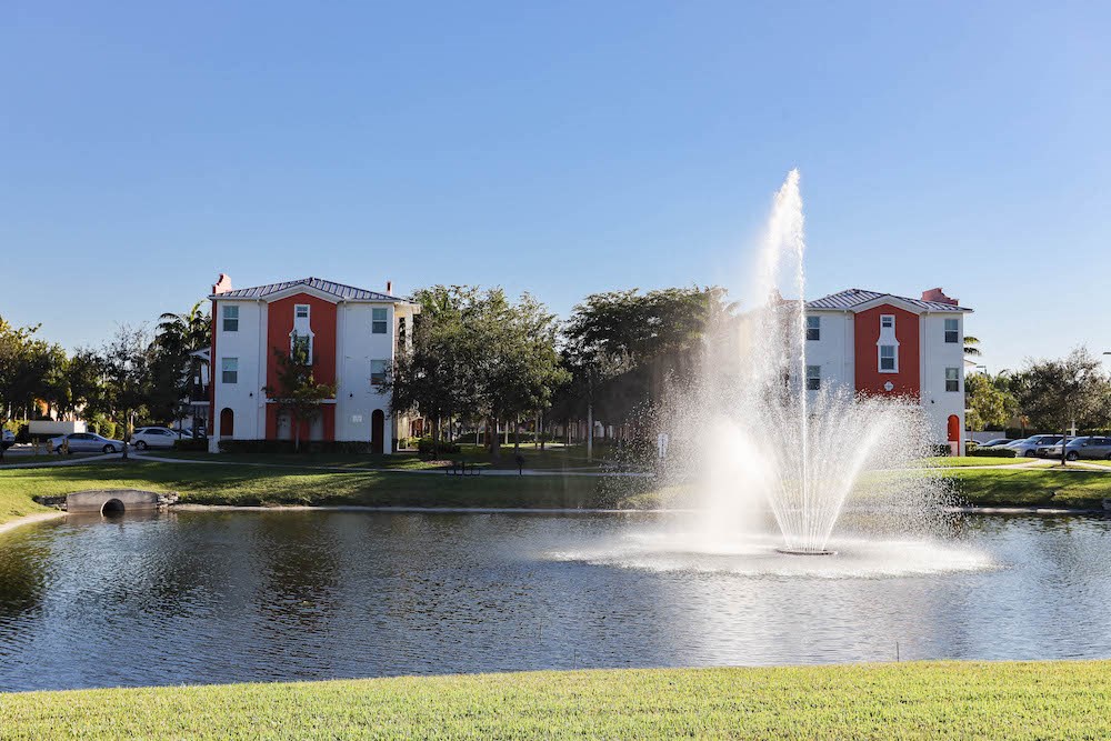 dancing fountain in lake at East Village Apartments