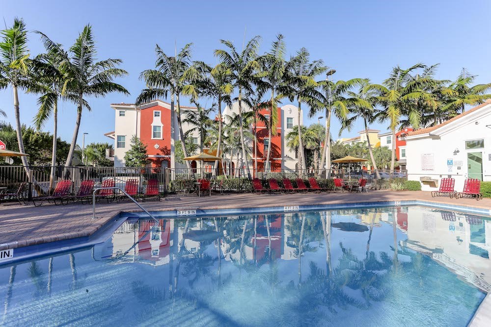 lush landscaping around East Village Apartments pool