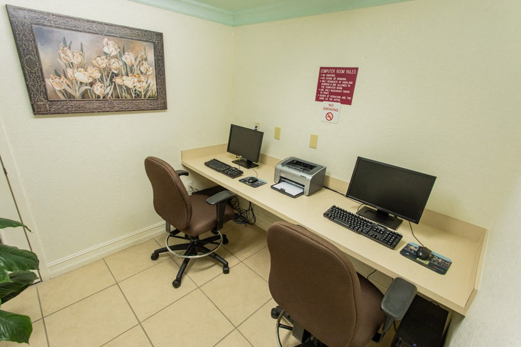 business center with computers and printer